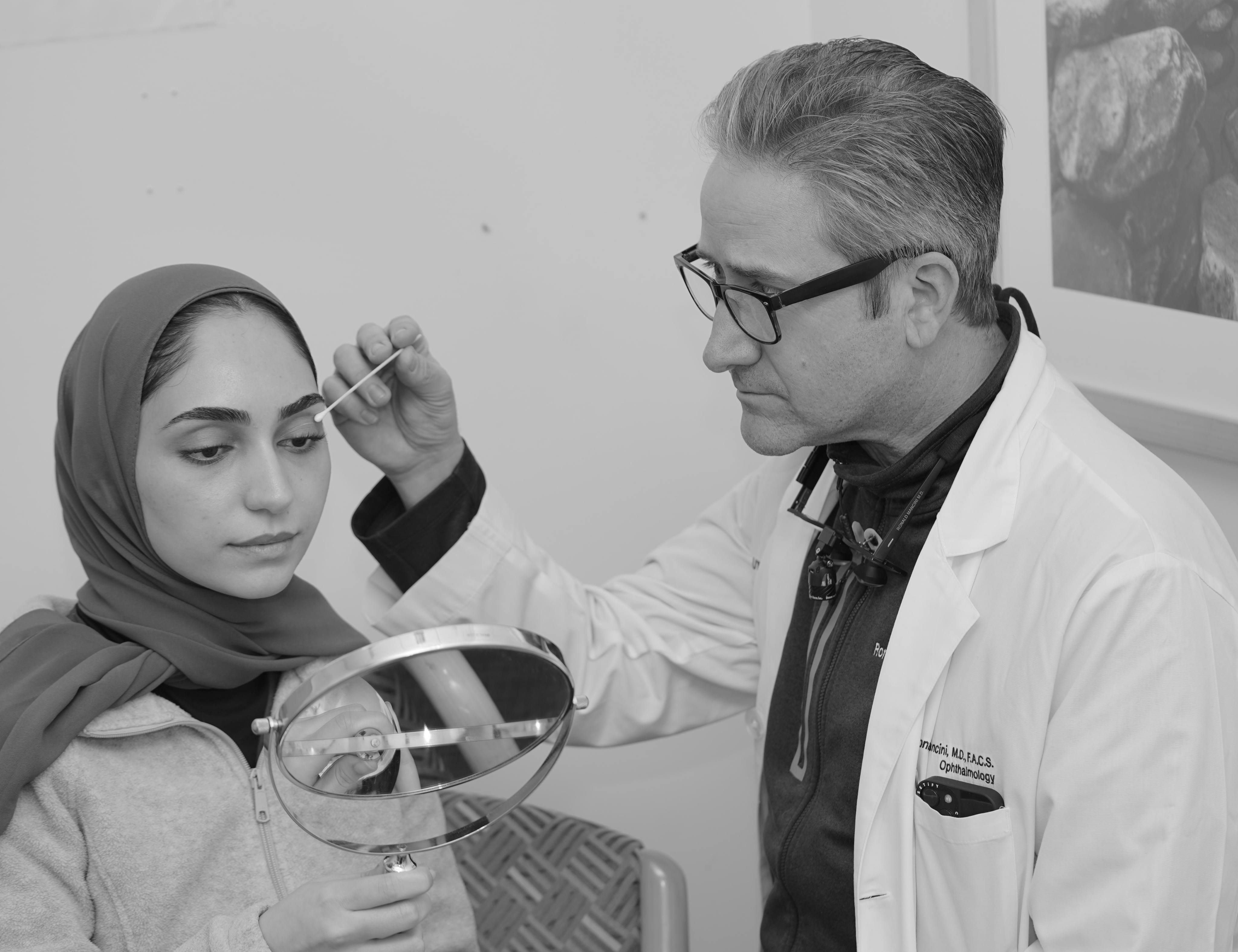 Dr. Ronald Mancini consulting with a patient
